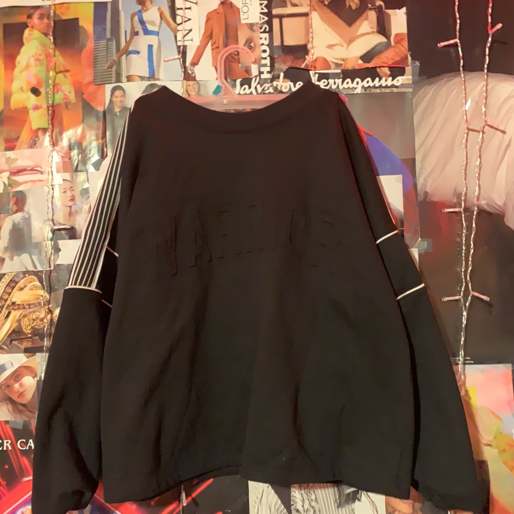 Black and white heavy sweatshirt , size 15-17 , has words “WARRIOR” on front